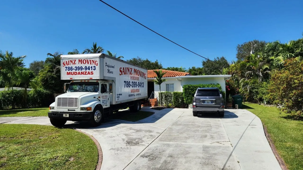 Sainz Moving box truck parked in a driveway in Miami