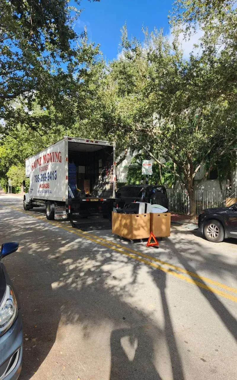 Sainz Moving truck on a shaded Miami street